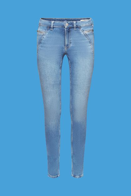 Úzké skinny džíny se středně vysokým pasem a kapsami na zip